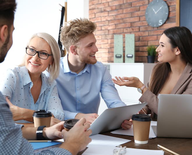 Employees talking during a business meeting