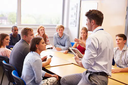 Professor talking to students during class