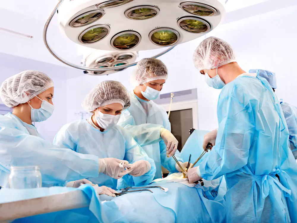 Group of doctors performing a surgery