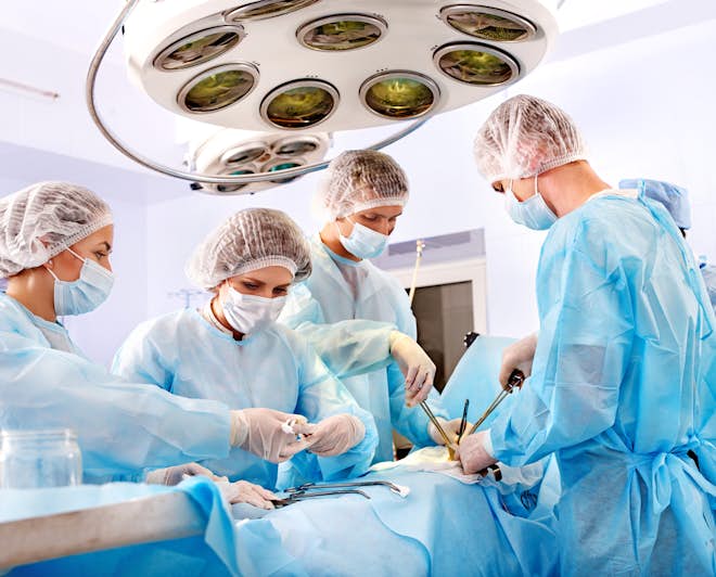 Group of doctors performing a surgery