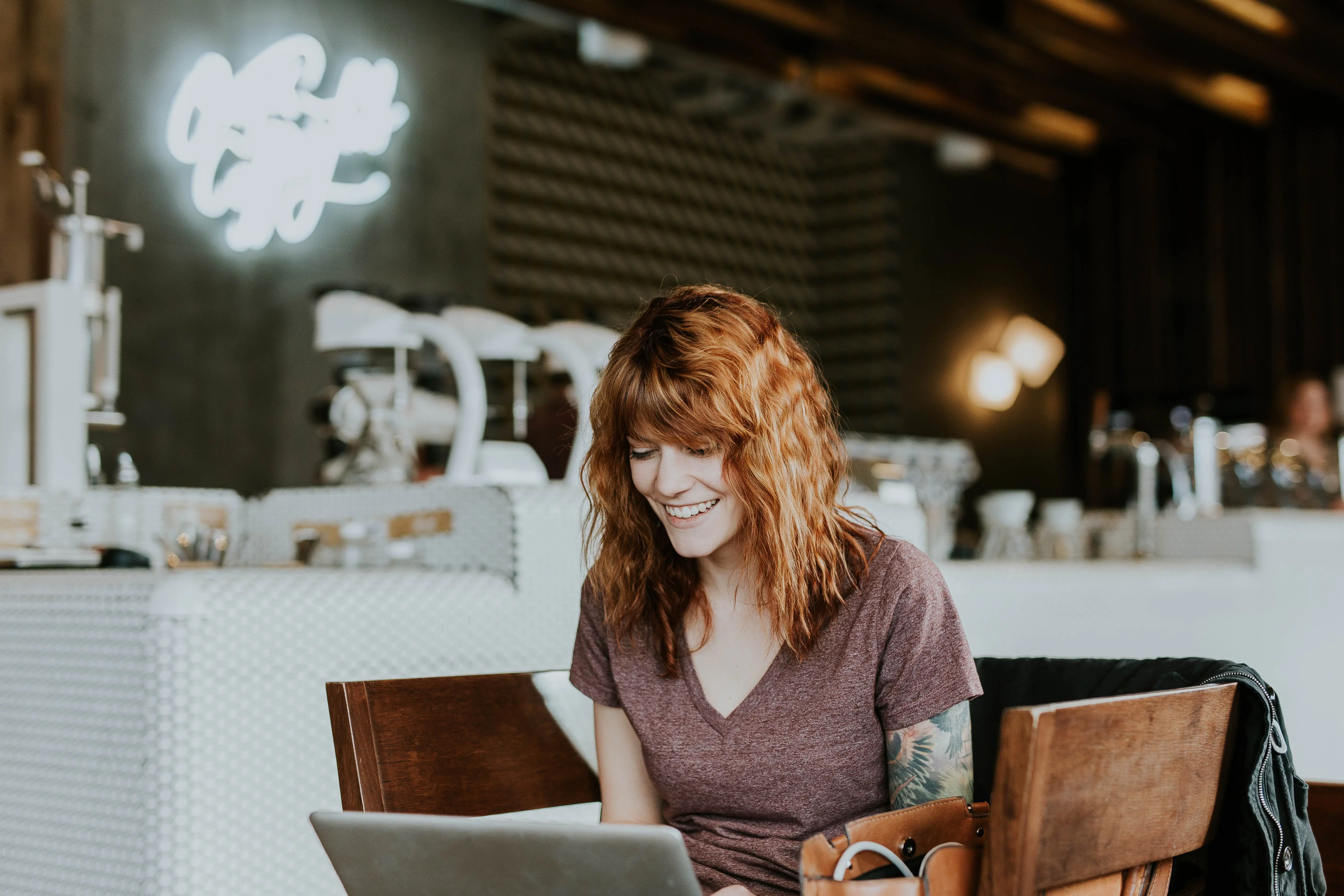 College student working online on her laptop in a cafe