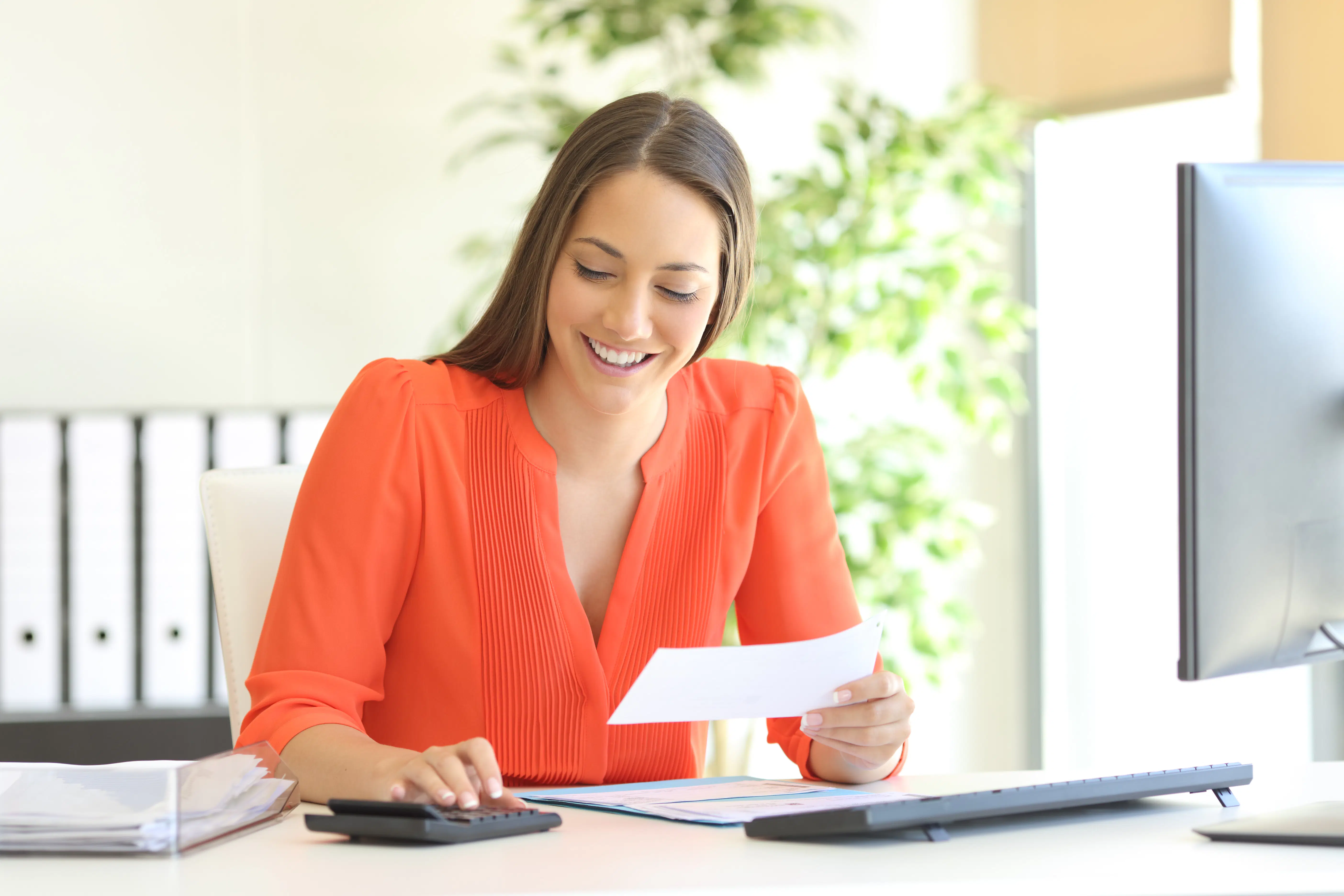 Actuarial professional working at her desk
