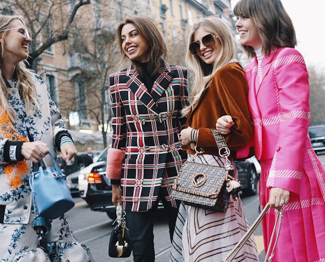 Girls wearing fashionable clothes during the Milan Fashion Week