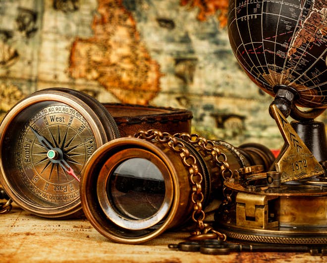 Historical objects: Earth globe, compass, binoculars, old map
