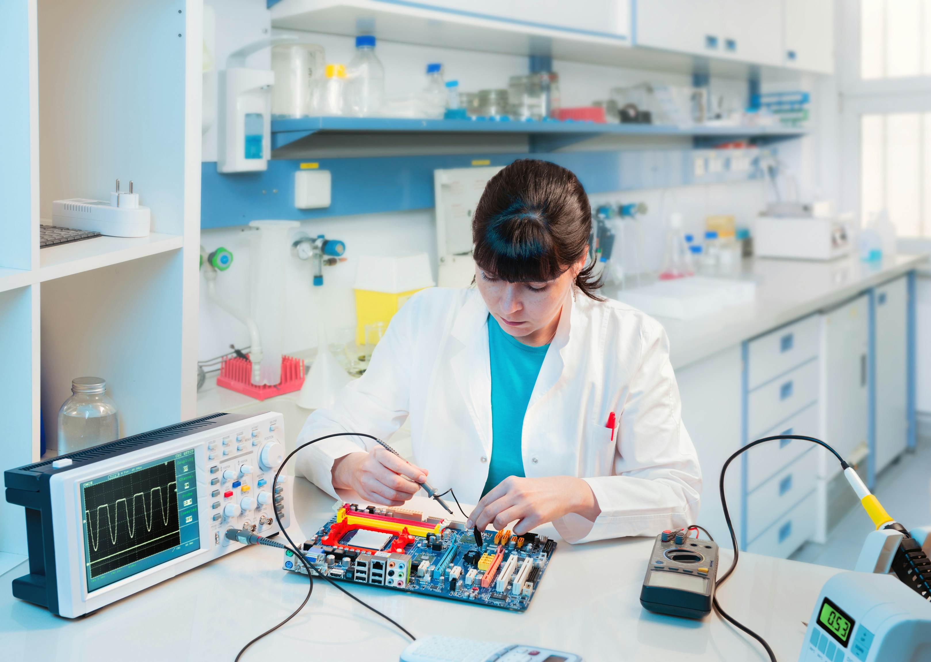 Computer scientist fixing a computer motherboard