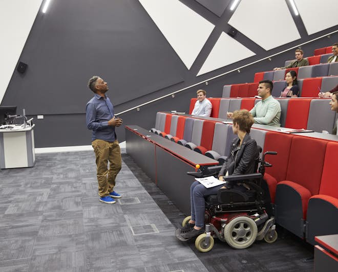 Student with disability attending university lecture
