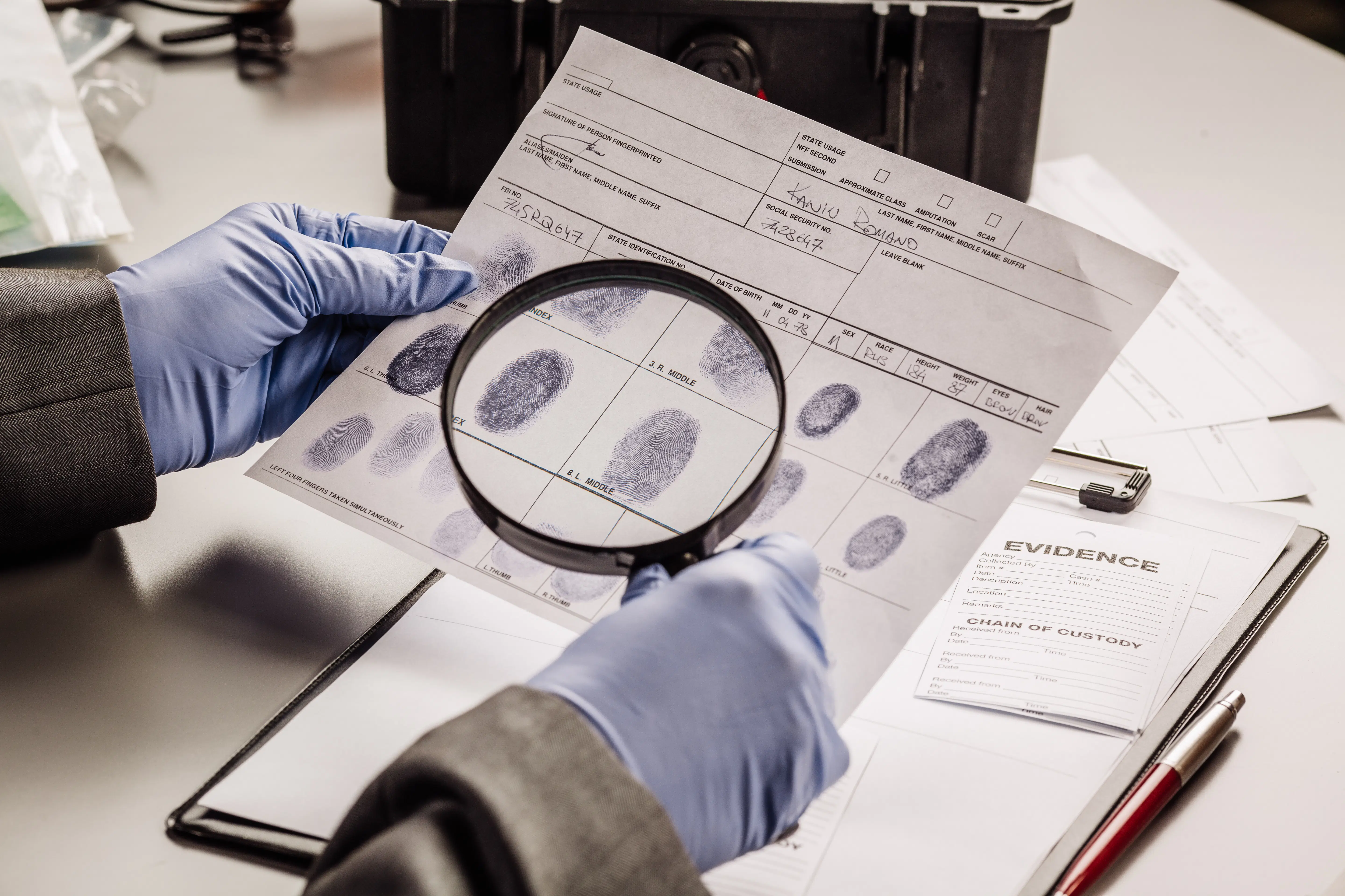 Criminology expert examines fingerprint